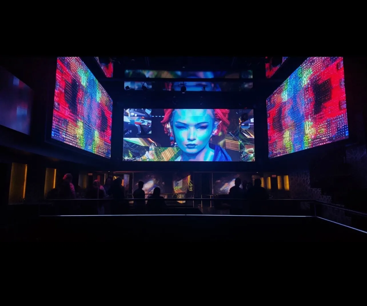 Immersive dark event space wrapped in synchronized LED screens